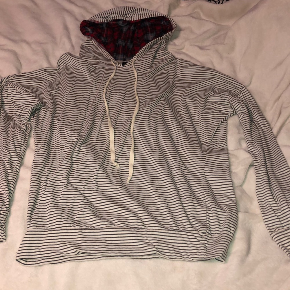 Striped sweater with flannel pattern inside